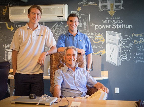 Fuelbox co-founders CEO Robert Herr, left, and Dan Friedman, right, with Score business mentor Bob Vitamante, seated. As chairman of the Santa Barbara chapter of Score, Vitamente is a veteran business coach. The national Score group turns 50 this year. (Nik Blaskovich / Business Times photo)