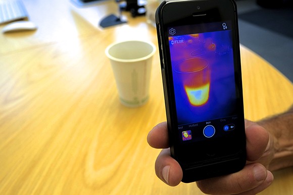 Flir General Manager Bill Terre shows the company’s new infrared phone app recording a cup of coffee. (Stephen Nellis / Business Times photo)