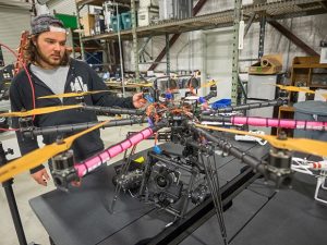 Associate Producer John Haas shows a custom built camera drone in Studio 32 at Hollywood Motion Picture Experience.