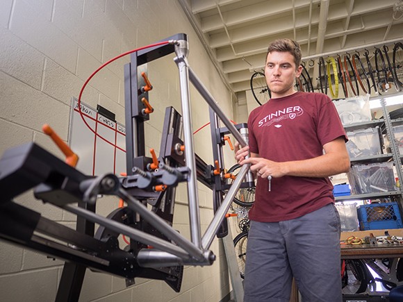 Aaron Stinner works in his shop near the Santa Barbara Airport. His company, Stinner Frameworks, has a fast-growing presence in the world of hand-built bicycles. (Nik Blaskovich / Business Times photo)